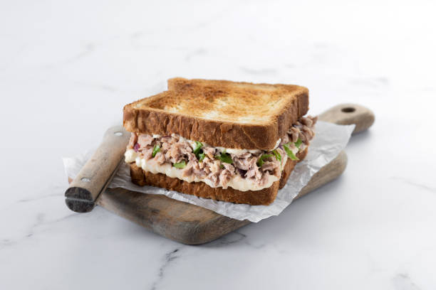 istock Tuna sandwich with mayo and vegetables on white marble 1485998615