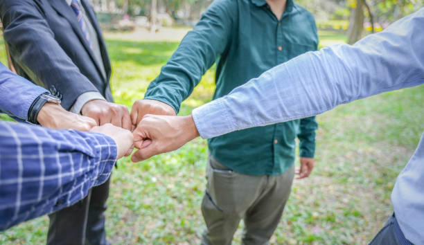 istock World environment day Global community teamwork, CSR and ESG environmental energy saving partnerships work together for the Sustainable Development Goals. People join for cooperation success. 1486001178