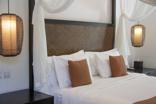 istock Simple contemporary bedroom with king size bed and mosquito net 1486005711