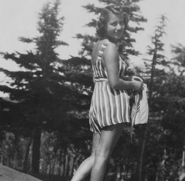 istock Young Woman in a garden, 1941. 1486006691