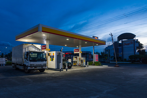 Daraga, Albay, Philippines - Sept 2022: A Shell Gasoline Station along the highway at dawn.