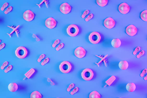 Summer holiday travel objects on neon lighting background