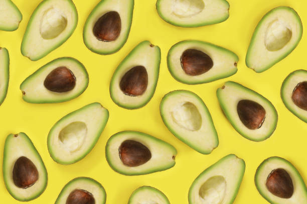 istock Sliced avocados on a yellow background, top view, flat lay 1486013807