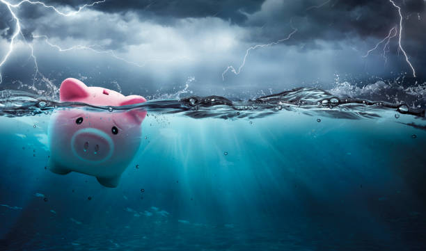 Piggy Bank At Risk To Drowning In Debt - Crisis Financial Banking Concept -  Contain 3d Rendering stock photo
