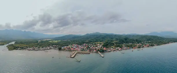 An aerial view of a traditional fishing village in the midst of majestic mountains, Southern Leyte, Philippines