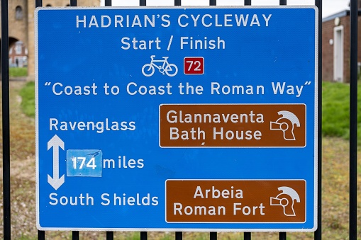 South Shields, United Kingdom – April 23, 2023: Sign at the Start Finish of the Hadrian's Cycleway at Arbeia, South Shields, South Tyneside, crossing the UK and incorporating Roman historic sites.