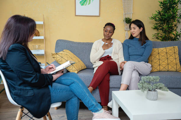 Multiracial lesbian couple, at the couple therapy led by the female psychotherapist