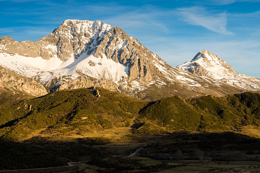 Snow-covered Peña Ubiña massif in the Natural Park of Babia y Luna at sunset, province of Leon, Castilla y Leon, Spain.