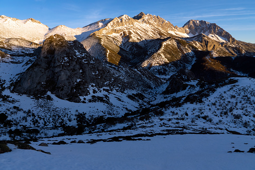 Snow-covered Peña Ubiña massif in the Natural Park of Babia y Luna at sunset, province of Leon, Castilla y Leon, Spain.