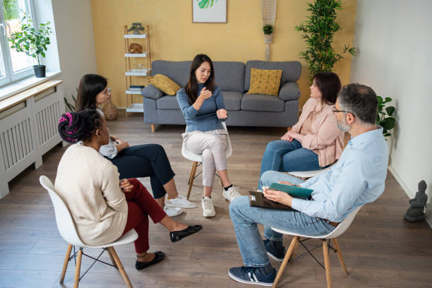 istock During multiracial group therapy, woman sharing her thoughts and emotions 1486029379
