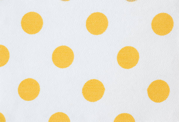 istock Yellow polka dots on white textile background 1486030481