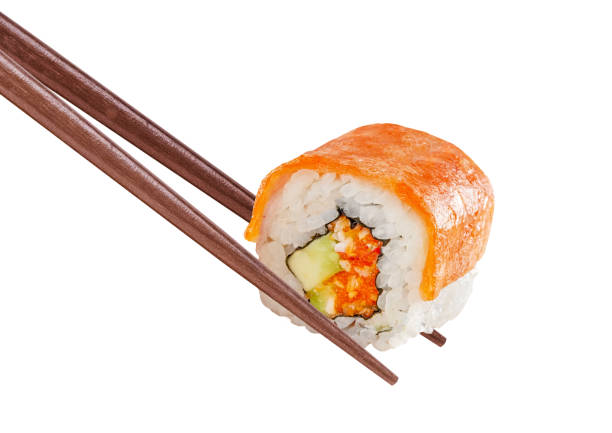 istock Fresh sushi with red fish or Sushi roll with salmon with chopsticks isolated. 1486030666