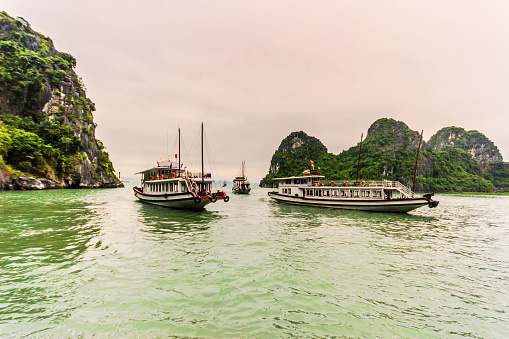 Holiday in Vietnam : Ha Long Bay, in northeast Vietnam, is known for its emerald waters and thousands of towering limestone islands topped by rainforests.