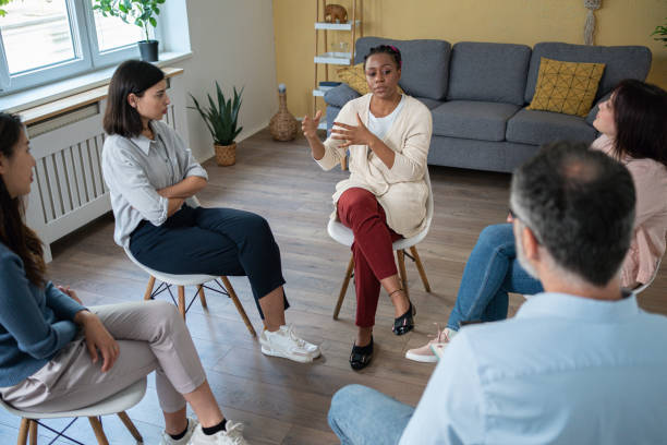 istock During multiracial group therapy, woman sharing her thoughts and emotions 1486032031
