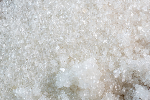 A very close view of rock salt used for melting ice on roads.