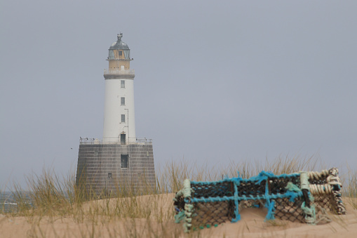 Lighthouse and lobster pot