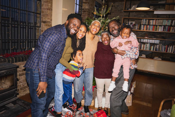 portrait of cheerful black family together for holiday - pre teen boy flash imagens e fotografias de stock