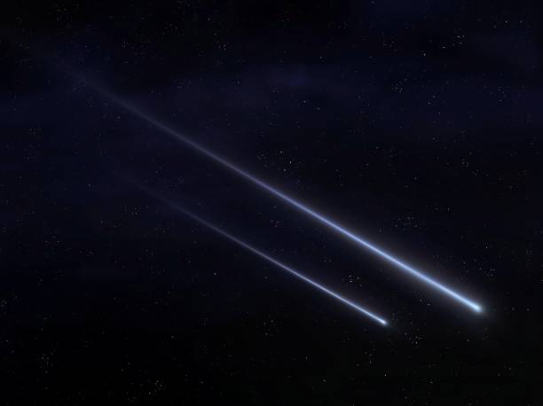 istock Bright meteorites in starry night sky. Two meteoroids on a black background. 1486040049