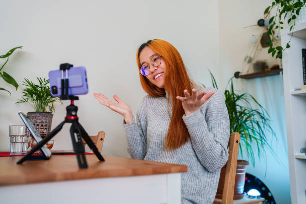 istock Woman vlogging with mobile phone 1486041383
