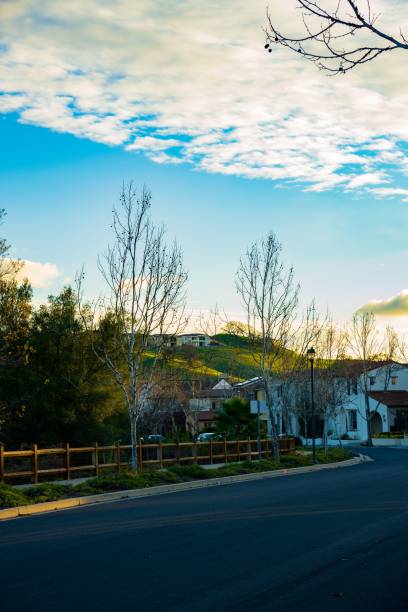 istock Rural road winding through a village during a beautiful sunset 1486042723