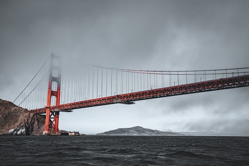 A majestic view of the Golden Gate Bridge in San Francisco, California shrouded in fog