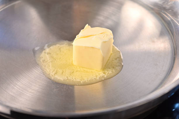 istock Melted butter in a frying pan. 1486047056