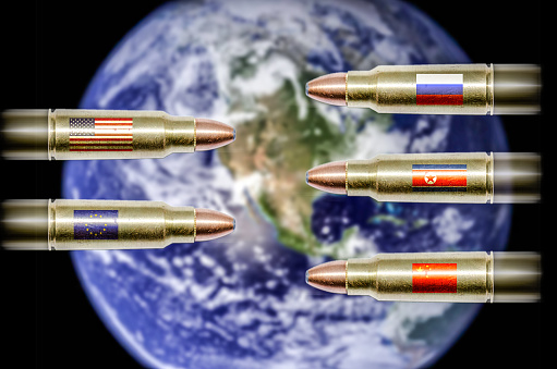 Bullets with flags (USA, EU, Russia, China and North Korea) flying towards each other with planet Earth as a background. This is to show the geopolitical tension there is currently between countries.