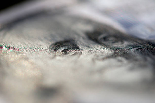 istock Hundred of US dollars on black background 1486048857