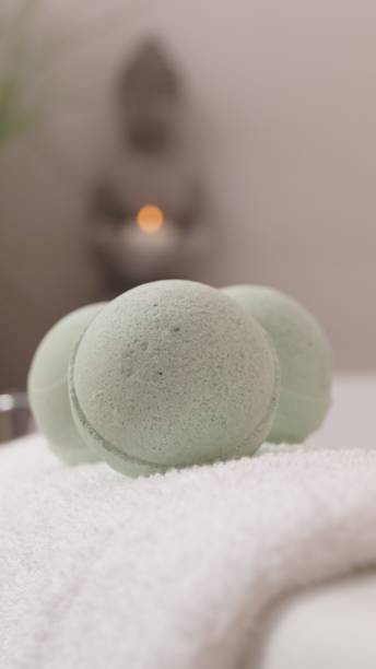 istock Towel with bath bombs on tub indoors, closeup 1486051851
