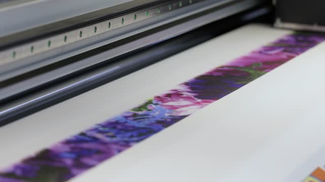 Industrial sublimation printer for digital printing on fabrics. Modern textile industry.