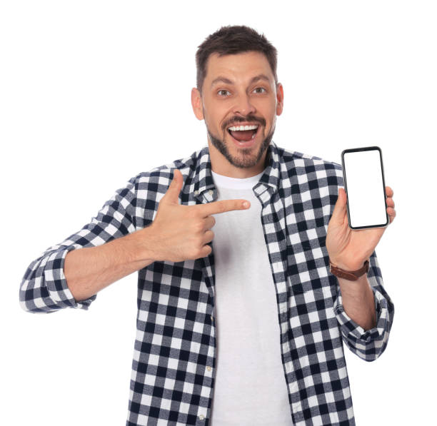 istock Emotional man pointing at smartphone on white background 1486055618