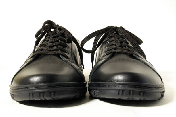 istock Front view of black leather sneakers 1486059288