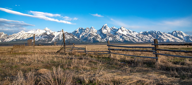 Ancient farm and ranch fence entry in the Yellowstone Ecosystem in Wyoming in western USA, North America. Nearest town is Jackson, Wyoming. Nearest cities are Denver, Colorado, Salt Lake  City, Bozeman and Billings, Montana.