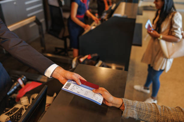 istock Caucasian Stewardess Returning A Passport To A Passenger 1486064138