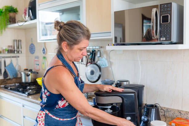 istock Happy woman is preparing proper meal in the kitchen. 1486065834