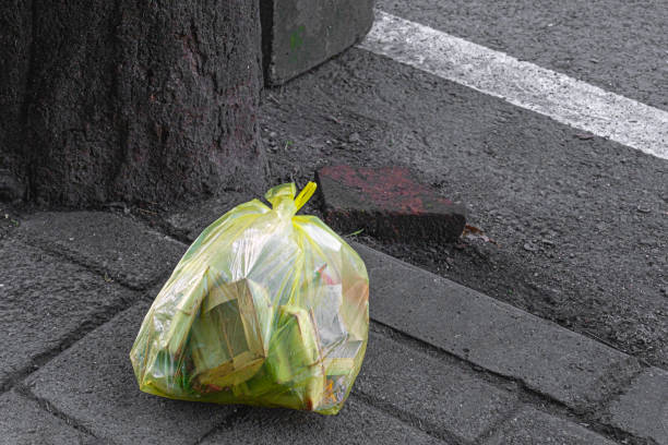 istock Cellophane bag of trash on pavement 1486069983