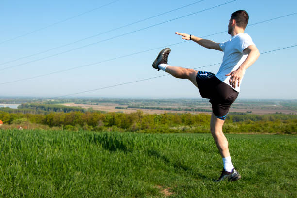 istock stretching before training, a beautiful view in nature, a healthy life 1486071603