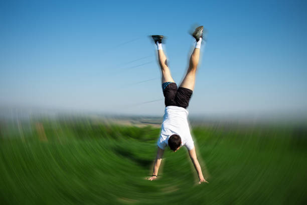 istock handstand on the meadow, healthy lifestyle 1486071609