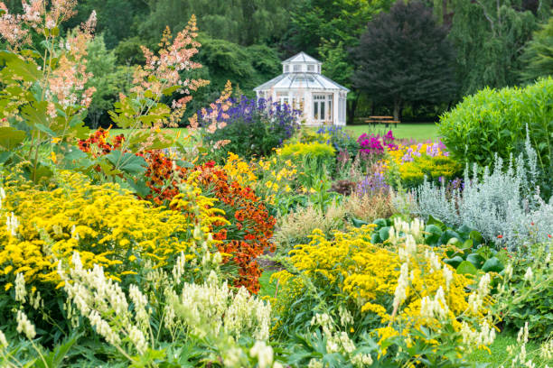 istock Gazebo and lavish flowerbeds 1486072915