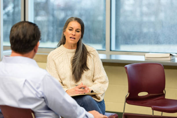 istock Female therapist clarifies male client's statement 1486074190