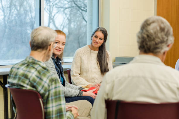 istock Support group members listen to unrecognizable senior man 1486074258