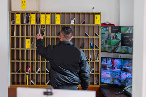 istock watchman is at his checkpoint watching the security of the complex from the cameras 1486074453