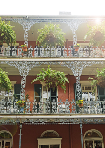 Building with ornate wrought iron railing balcony in the French Quarter of New Orleans