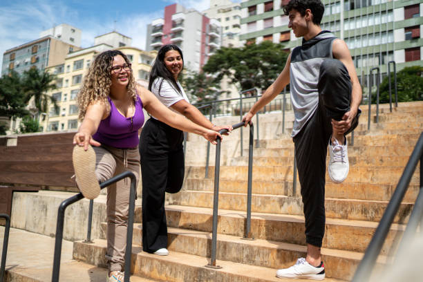 istock Friends stretching outdoors 1486076115