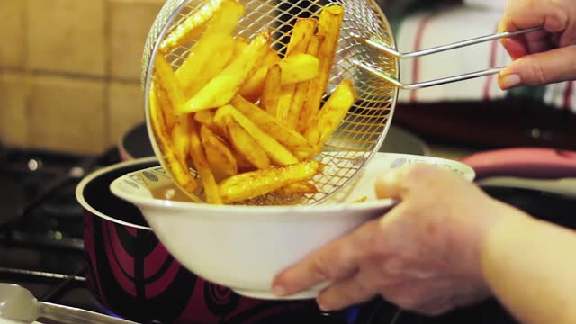 frying fish and chips in oil