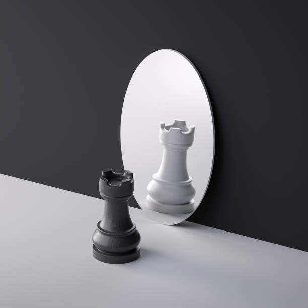 istock 3d rendering, chess game piece, black rook stands in front of the round mirror with different reflection. Duality concept. Psychological mental disorder condition. Minimalist scene 1486076916