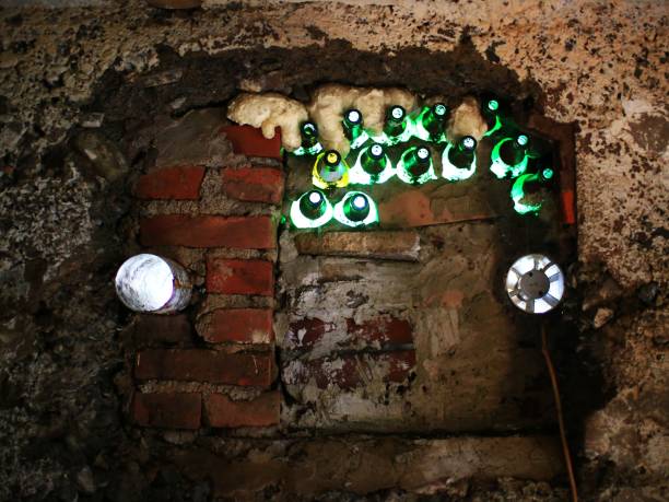 Makeshift window made of bricks, bottles and pipes for ventilation.