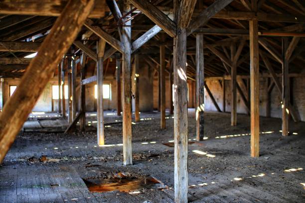 istock Old and dirty attic with bright daylight coming from outside 1486077448