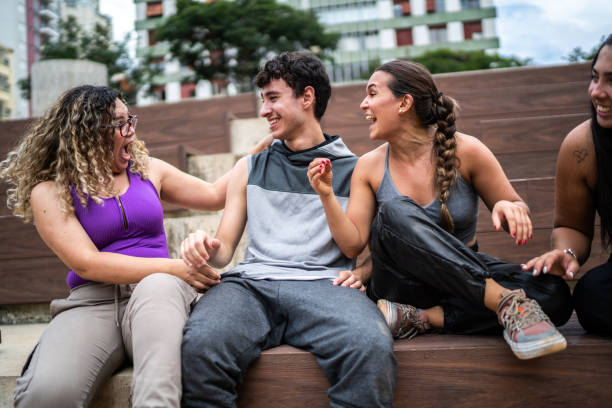 Happy friends talking outdoors