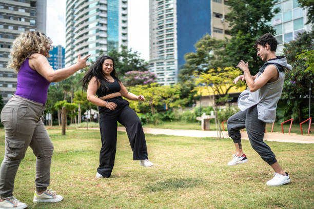 istock Friends dancing outdoors 1486078326
